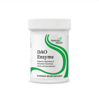White bottle labeled Seeking Health DAO Enzyme dietary supplement with green curved design containing 90 capsules, supports digestion of histamine from food, drink, and microbiome