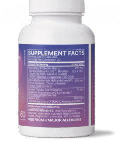 Supplement facts label on a white bottle with purple background, showing serving size of 2 capsules and 30 servings per container, listing proprietary probiotic blend, citrus bioflavonoids, golden tomato carotenoids, and vitamin K2 as key ingredients with their amounts and daily values, plus other ingredients and note of being free from 9 major allergens.