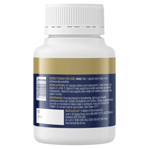 White supplement bottle with a gold and blue label showing directions, indications, warnings, and manufacturer contact information for BioCeuticals vitamin K2 capsules.