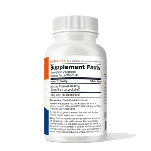 Back of a white supplement bottle showing the label with 'Supplement Facts' for activated charcoal capsules, including serving size of 2 capsules, 1000mg activated charcoal per serving derived from coconut shell, and additional usage directions and warnings.