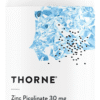 White bottle of Thorne Zinc Picolinate 30 mg dietary supplement with 60 capsules, featuring a blue crystalline design on the label