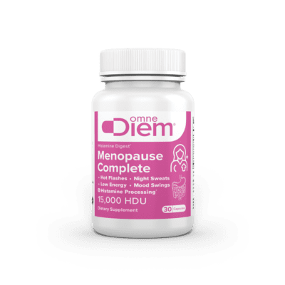 Supplement bottle labeled Omne Diem Menopause Complete for hot flashes, night sweats, low energy, mood swings, with 15,000 HDU, 30 capsules.